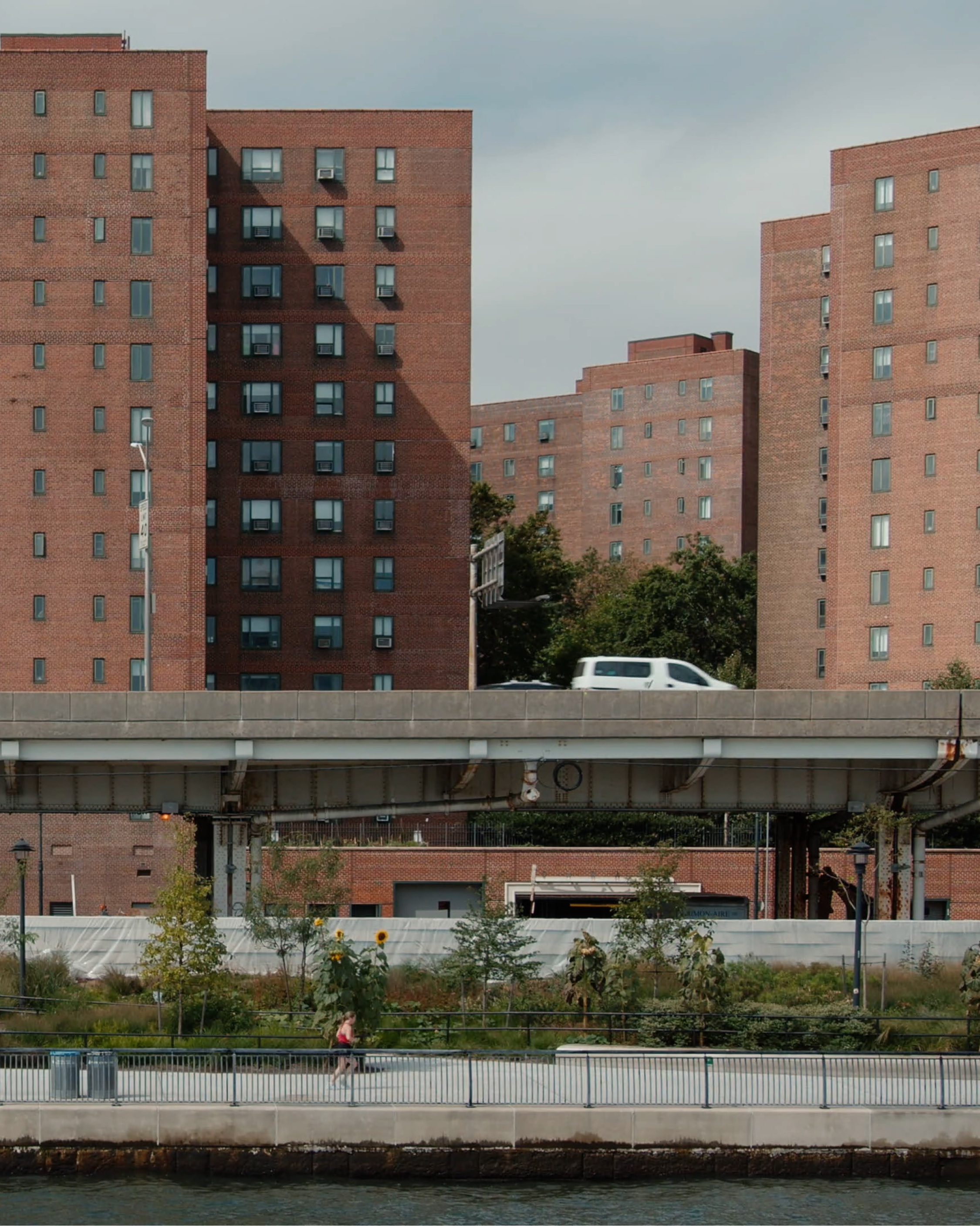 Raised freeway above new recreational spaces that also provide flood protection for Lower Manhattan.